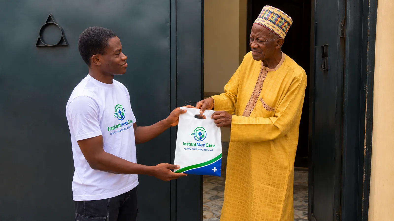 A man handing a bag to an older man