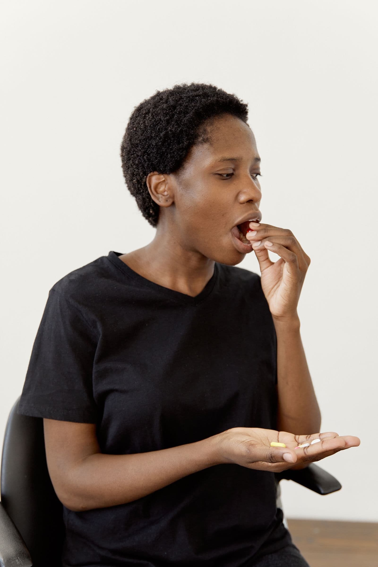 A woman reviewing her medication as part of her daily care routine
